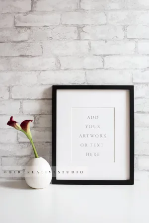Black Picture Frame with Calla Lilly, Stock image