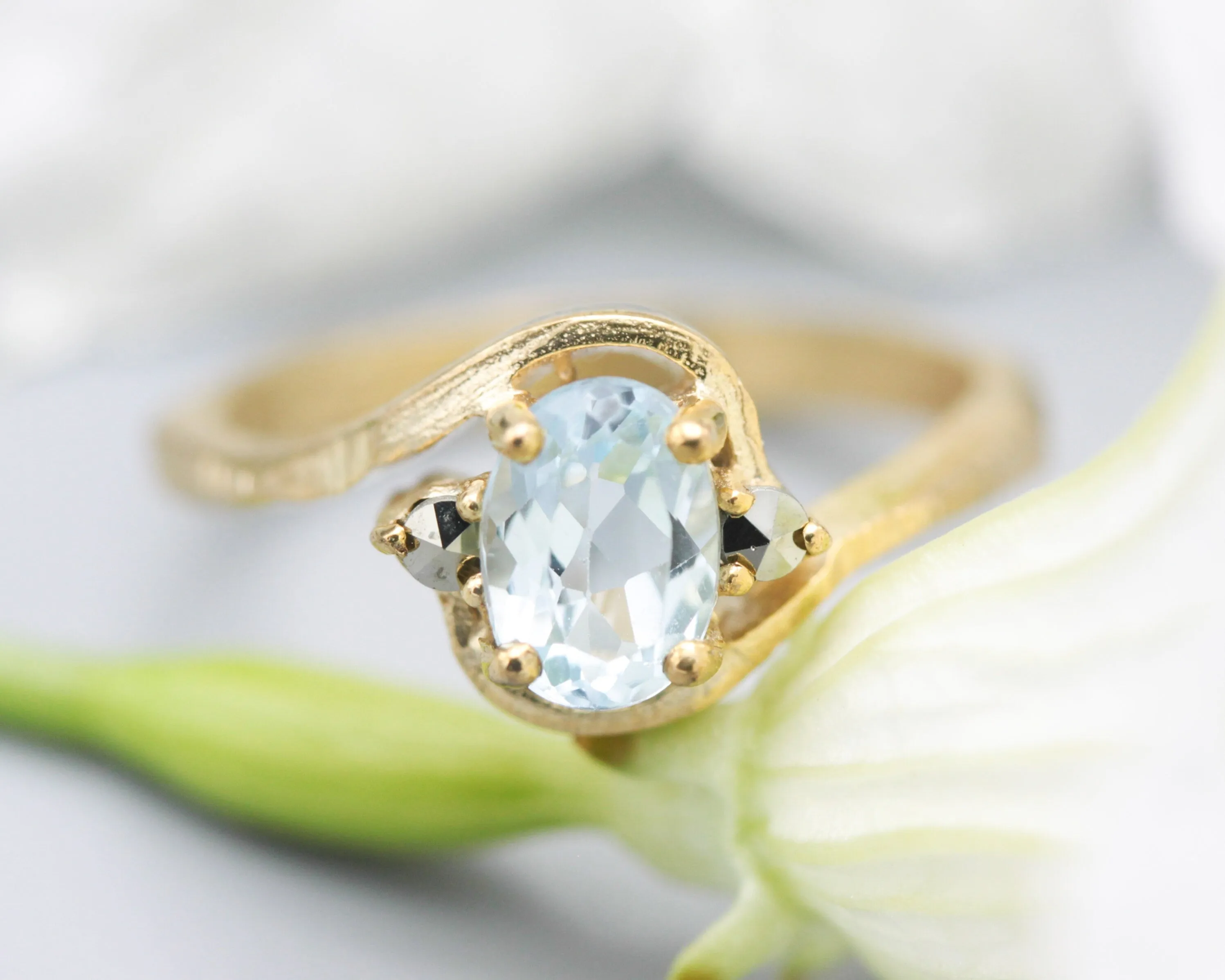 Oval Blue topaz ring and twin side set pyrite with 14k gold geometric texture band