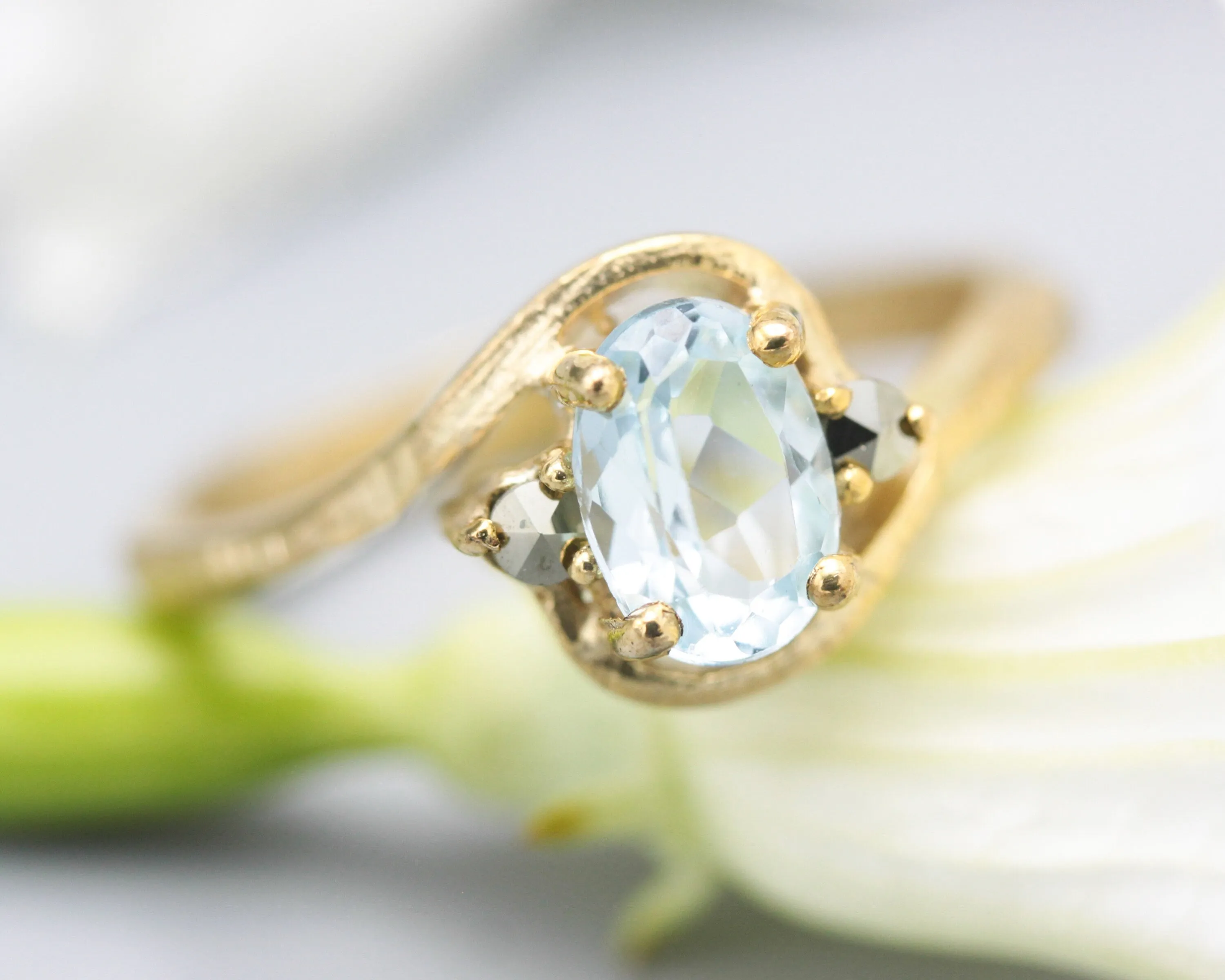 Oval Blue topaz ring and twin side set pyrite with 14k gold geometric texture band