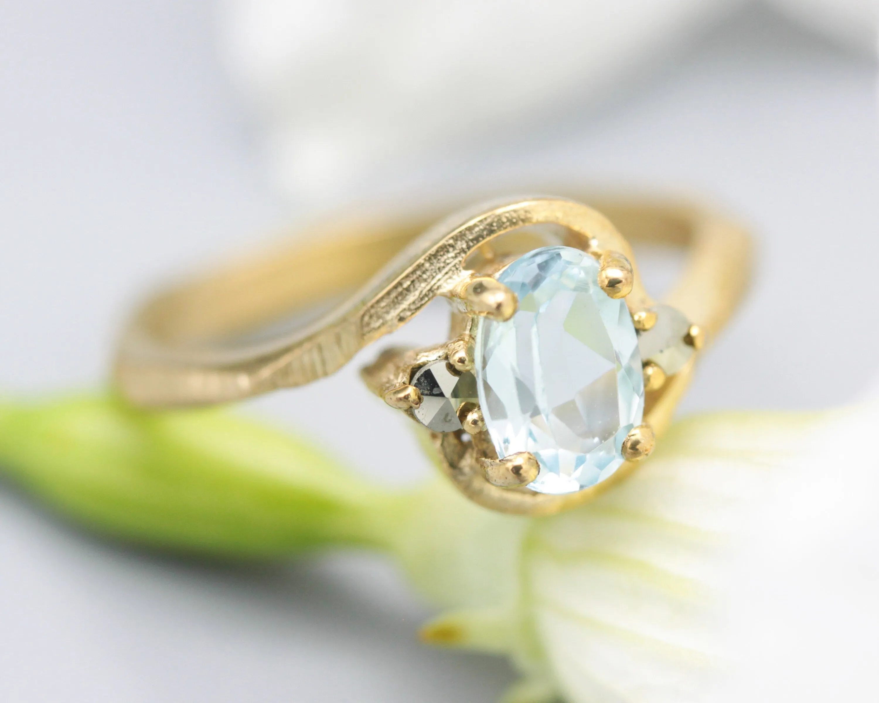 Oval Blue topaz ring and twin side set pyrite with 14k gold geometric texture band
