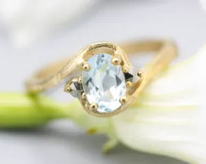 Oval Blue topaz ring and twin side set pyrite with 14k gold geometric texture band